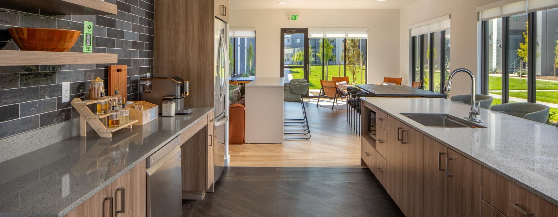 a kitchen with marble counters