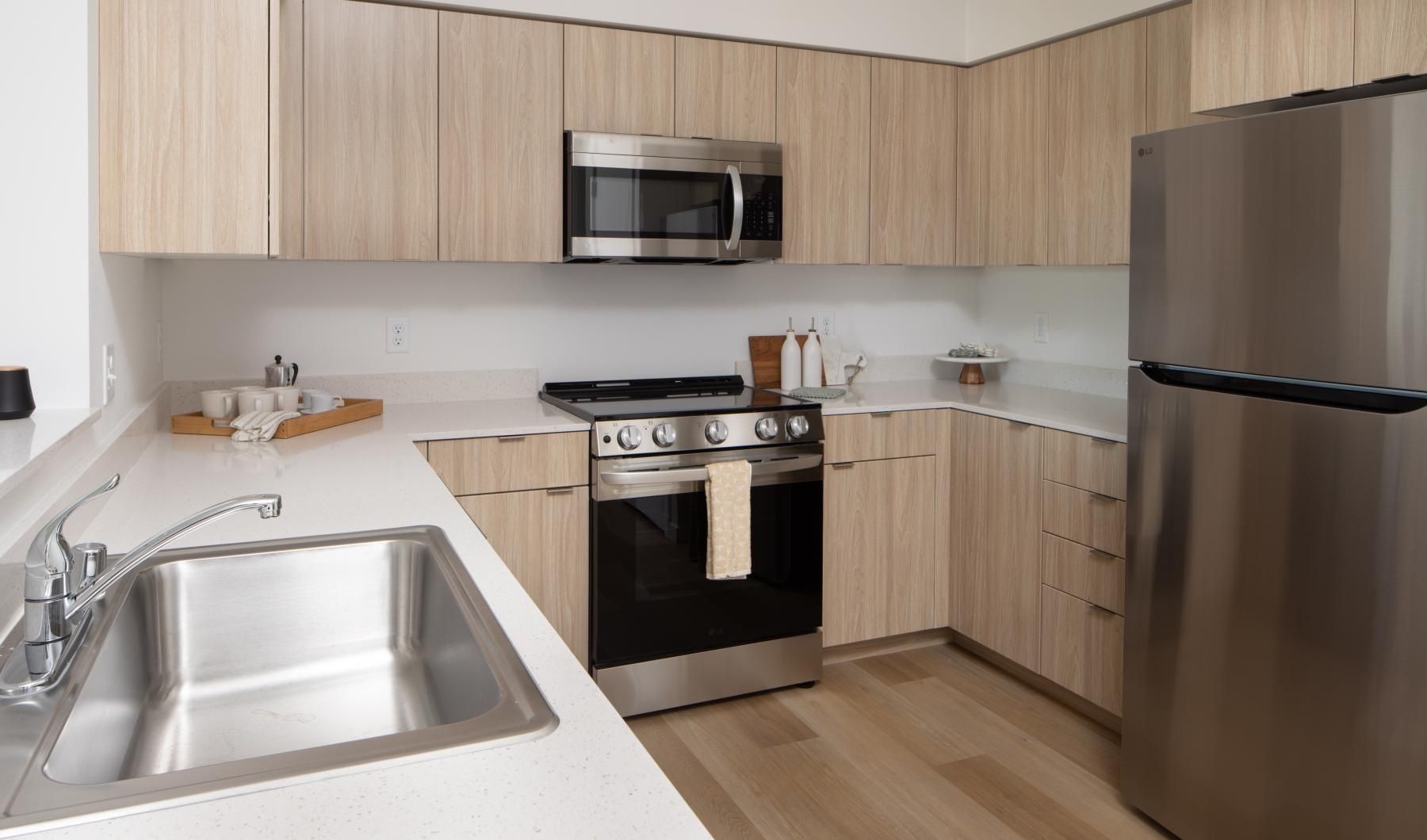 a kitchen with wooden cabinets